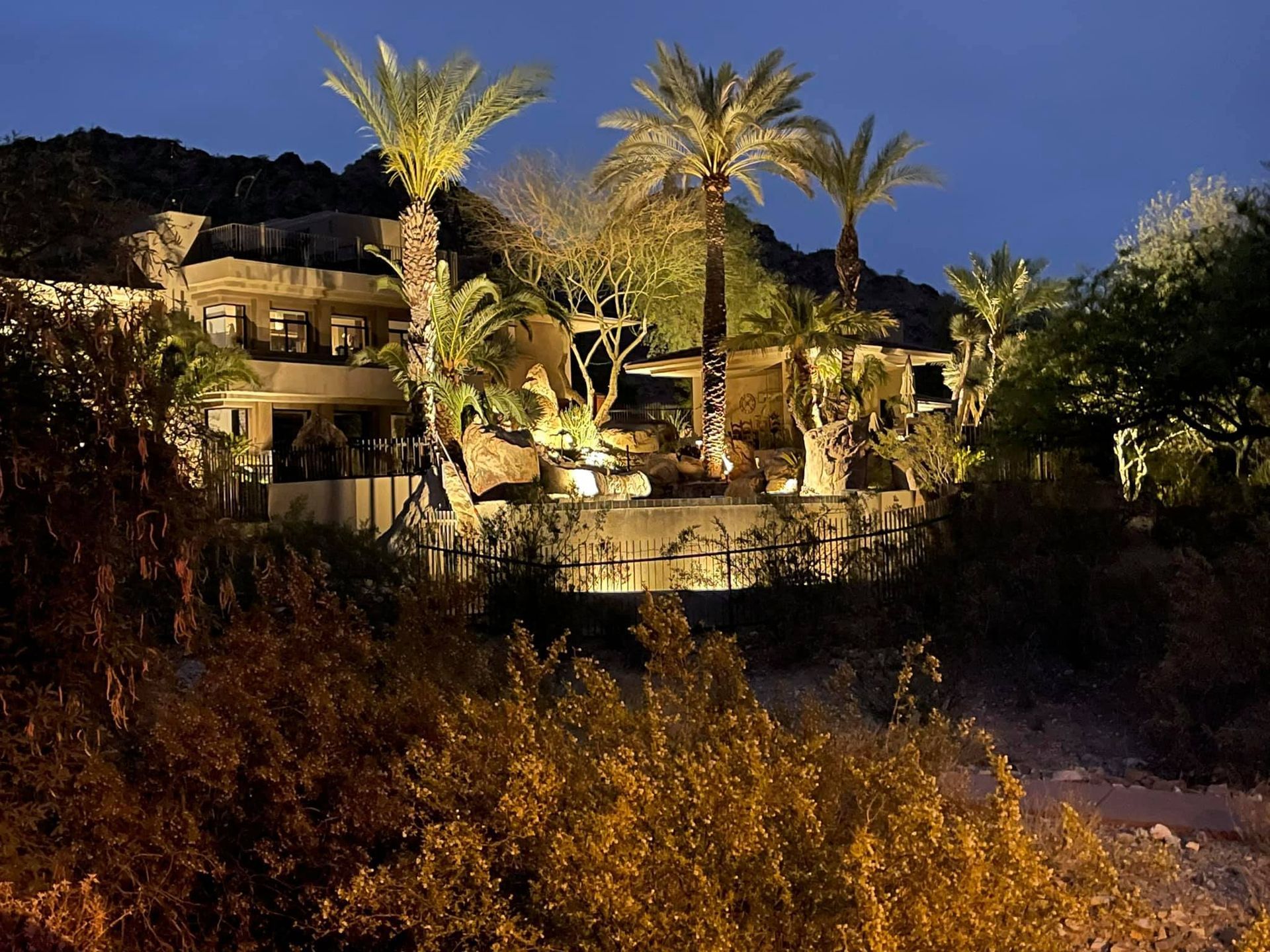 A large building with palm trees in front of it