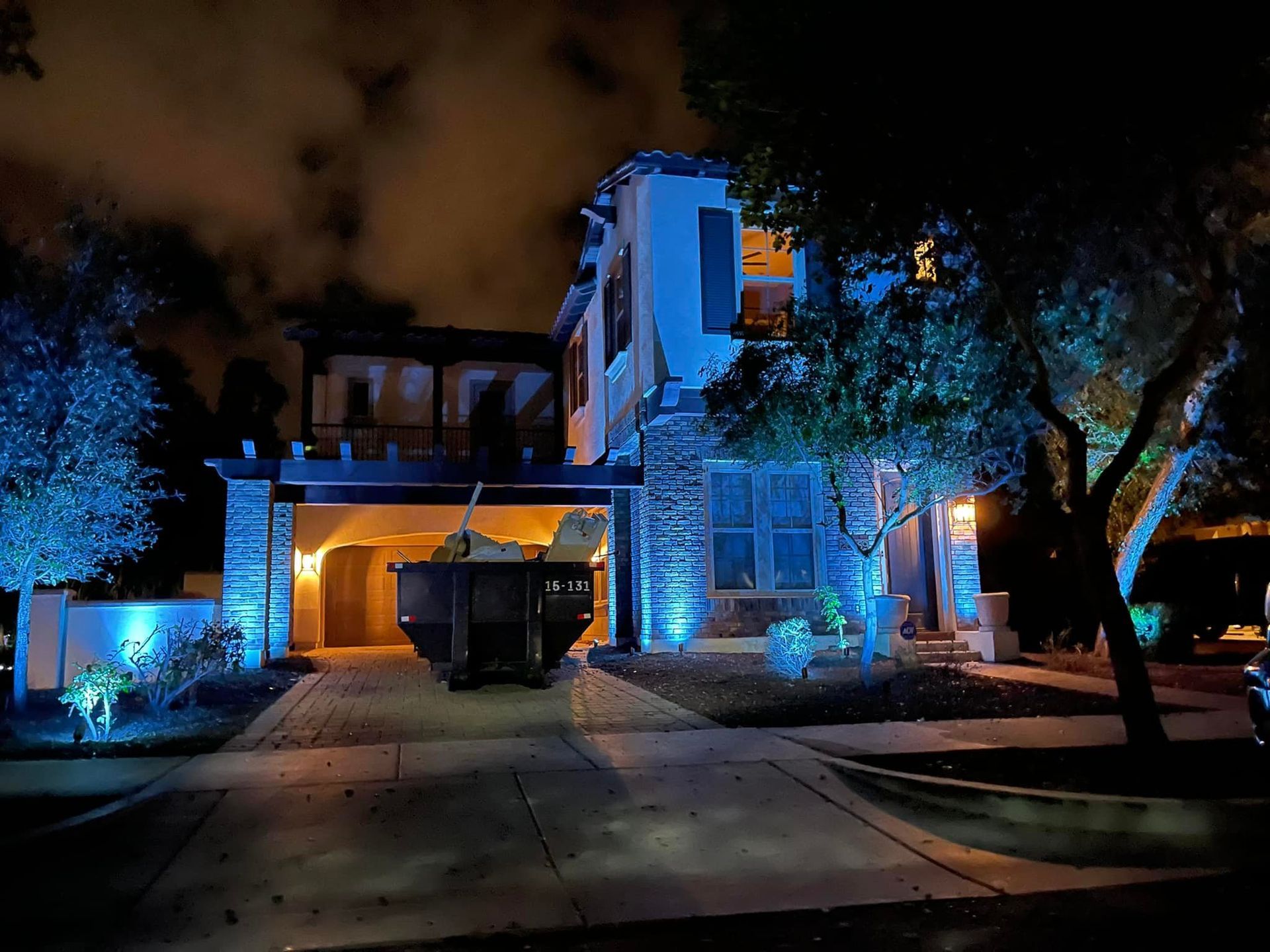 A house is lit up with blue lights at night