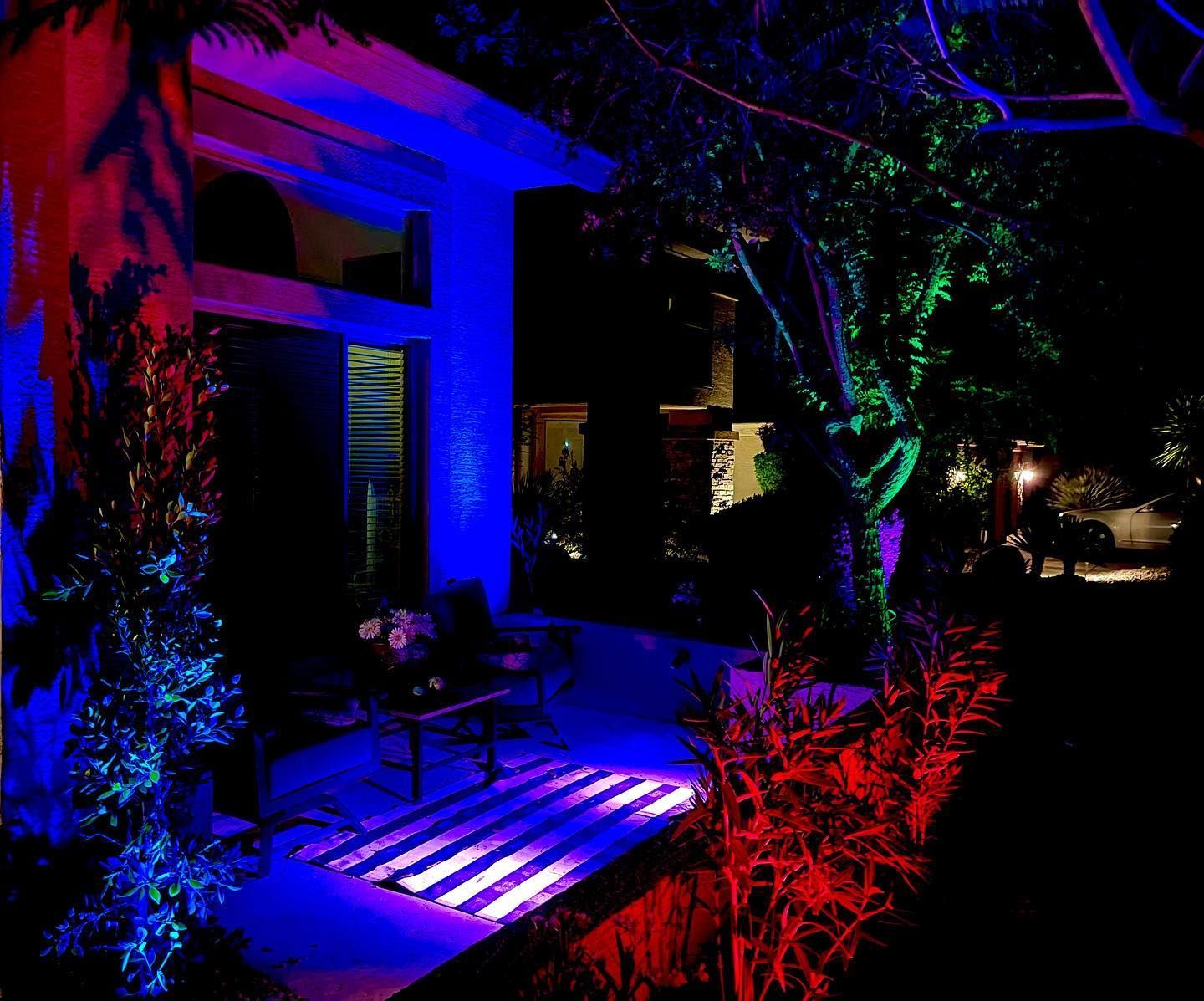 A house is lit up with blue and red lights