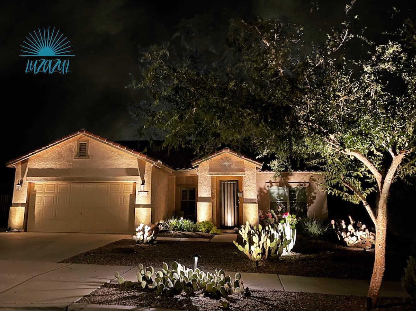 The front of a house is lit up at night