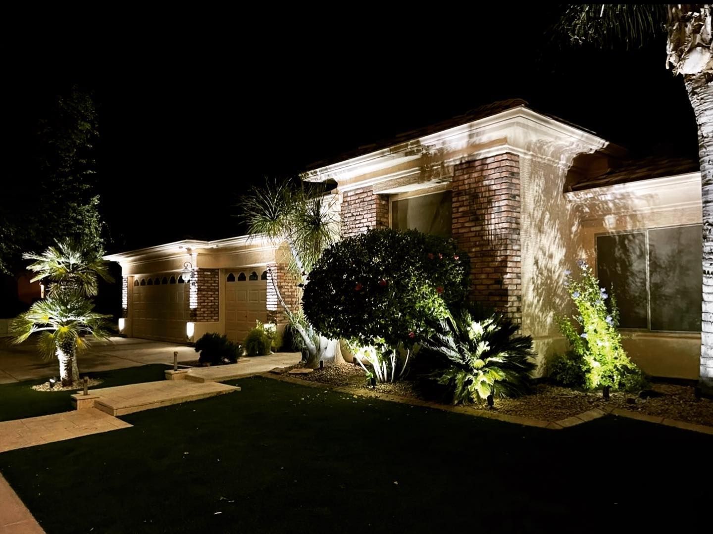 A house is lit up at night with lots of lights.