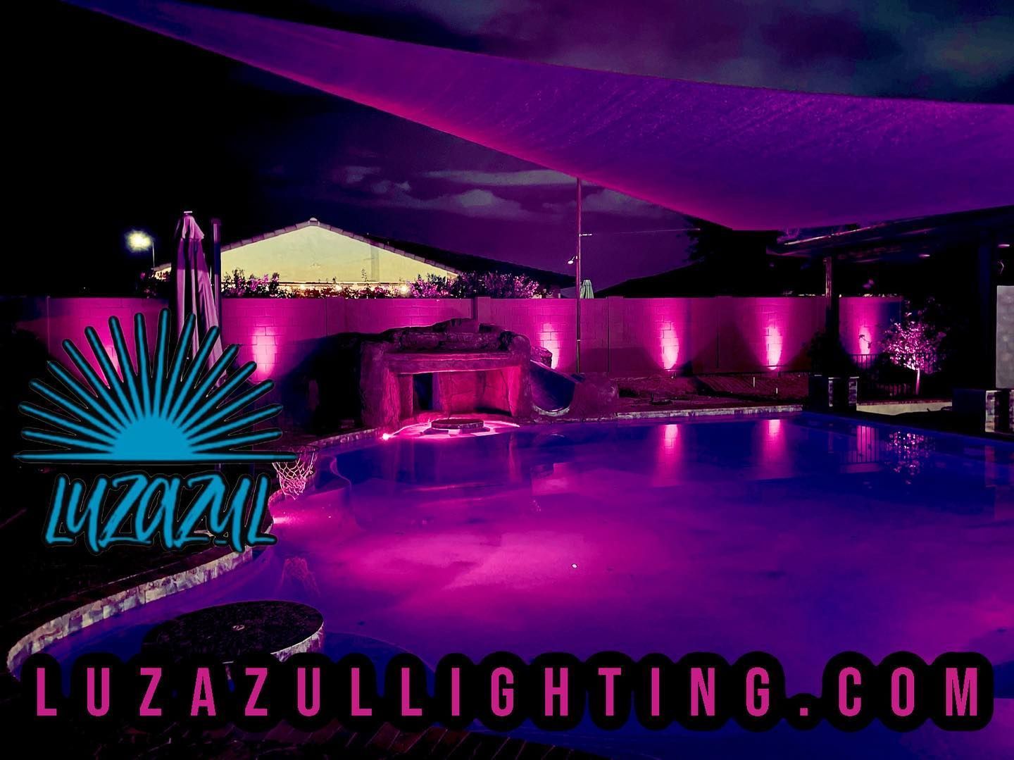 A swimming pool with purple lights and the website luzazullighting.com
