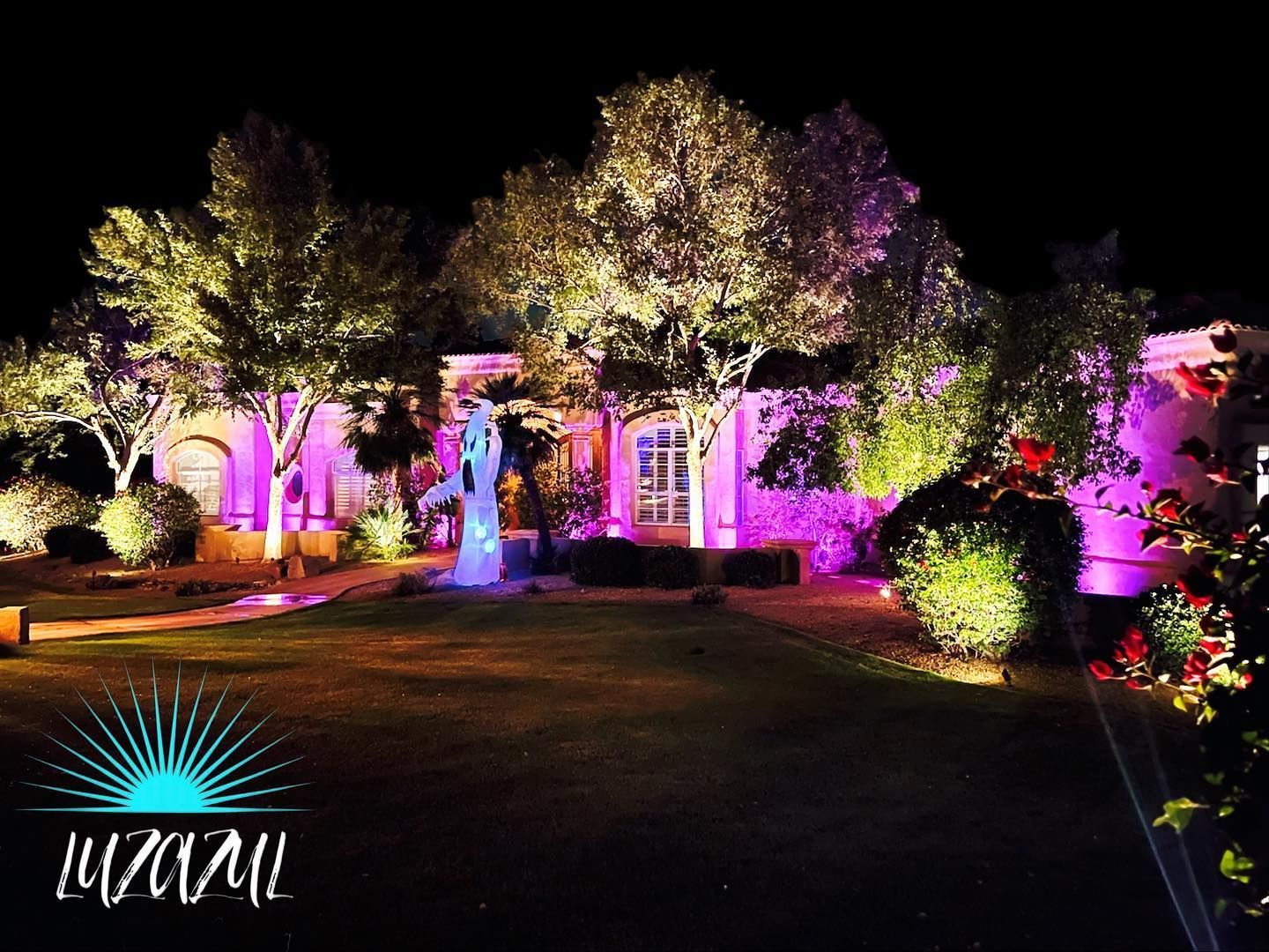 A house with a lot of lights on it at night