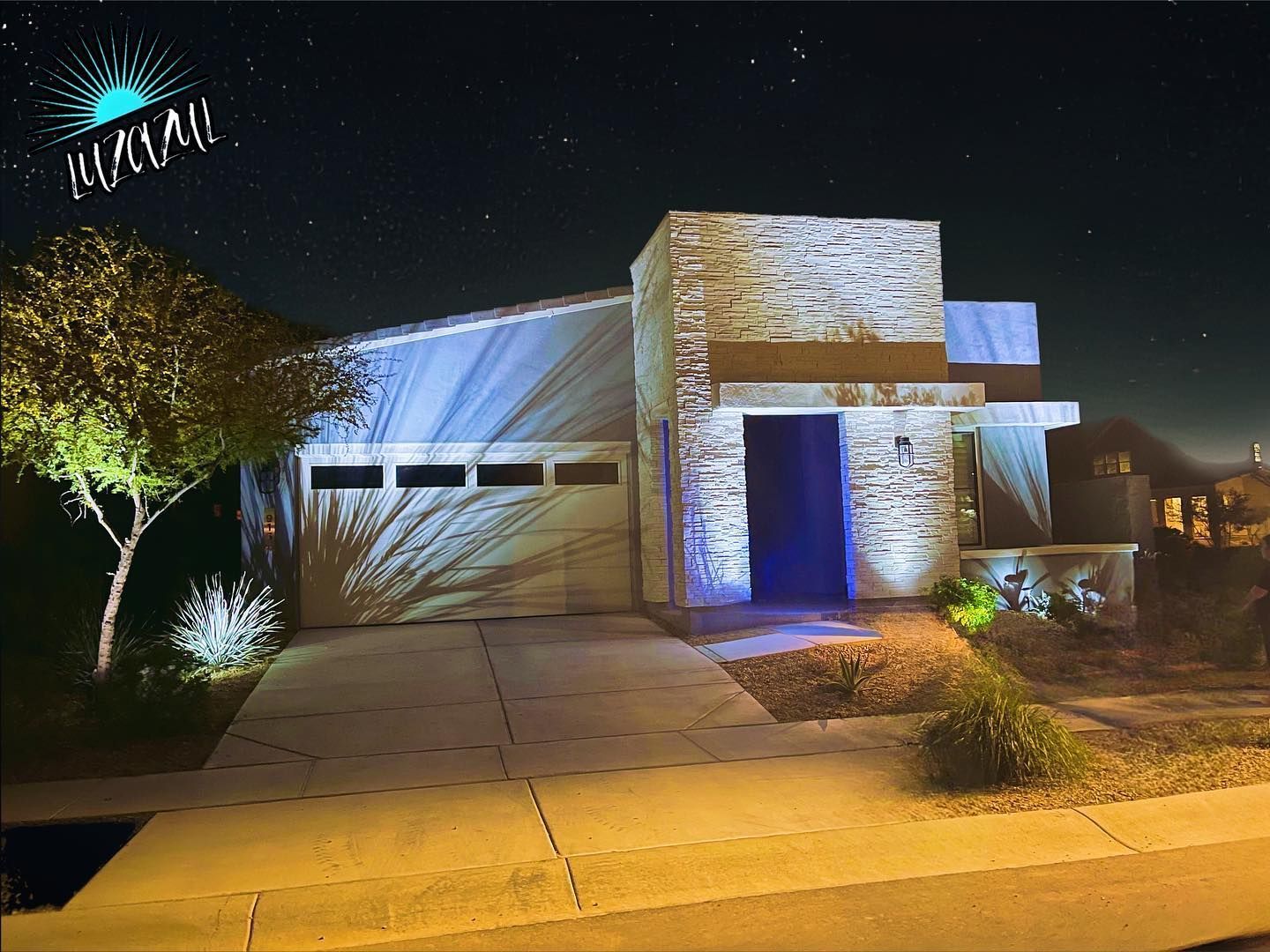 A house is lit up with blue lights at night