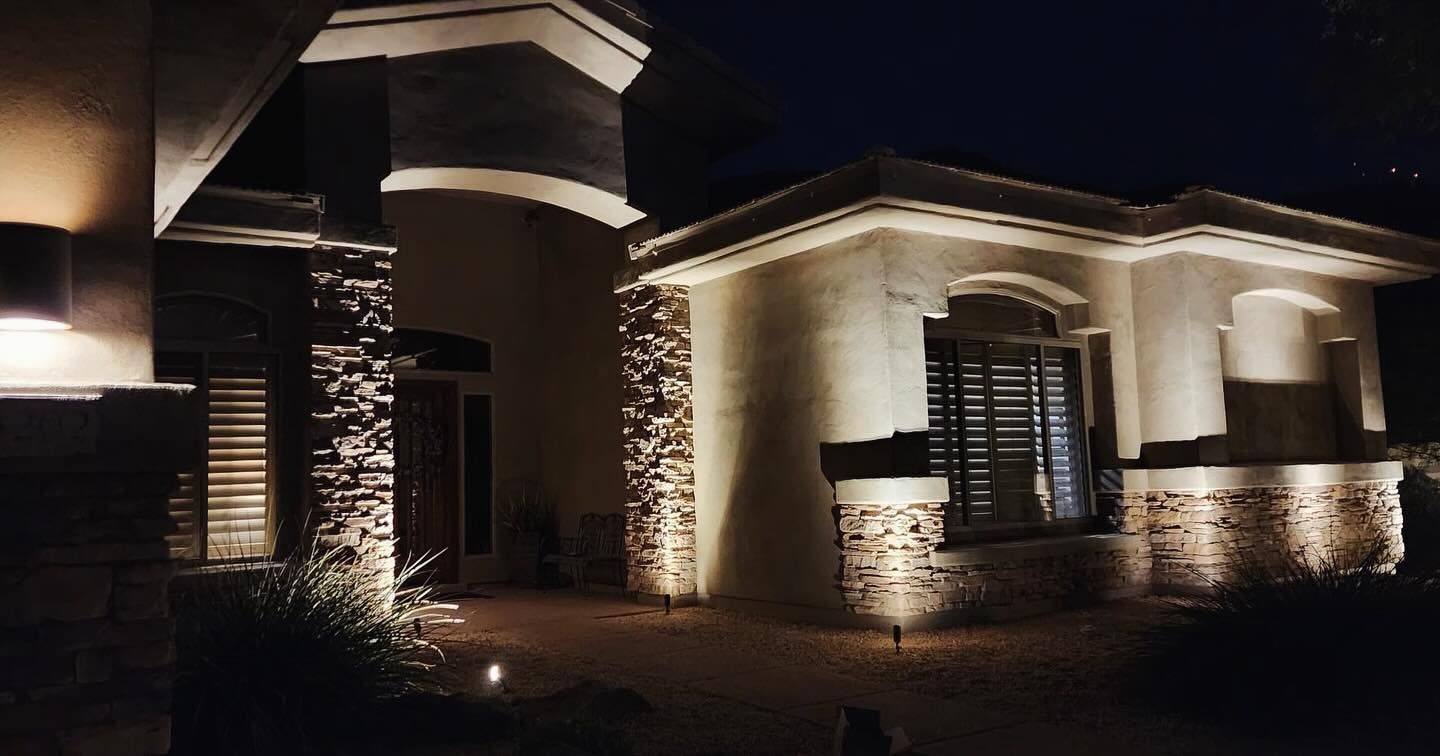 A house with a lot of lights on it at night