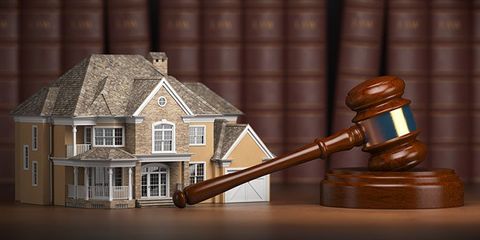 Real Estate Attorney - House With Gravel And Law Books in Asheville, NC