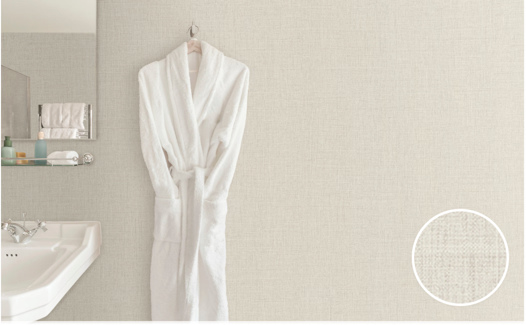 A bathrobe is hanging on a hook in a bathroom next to a sink.