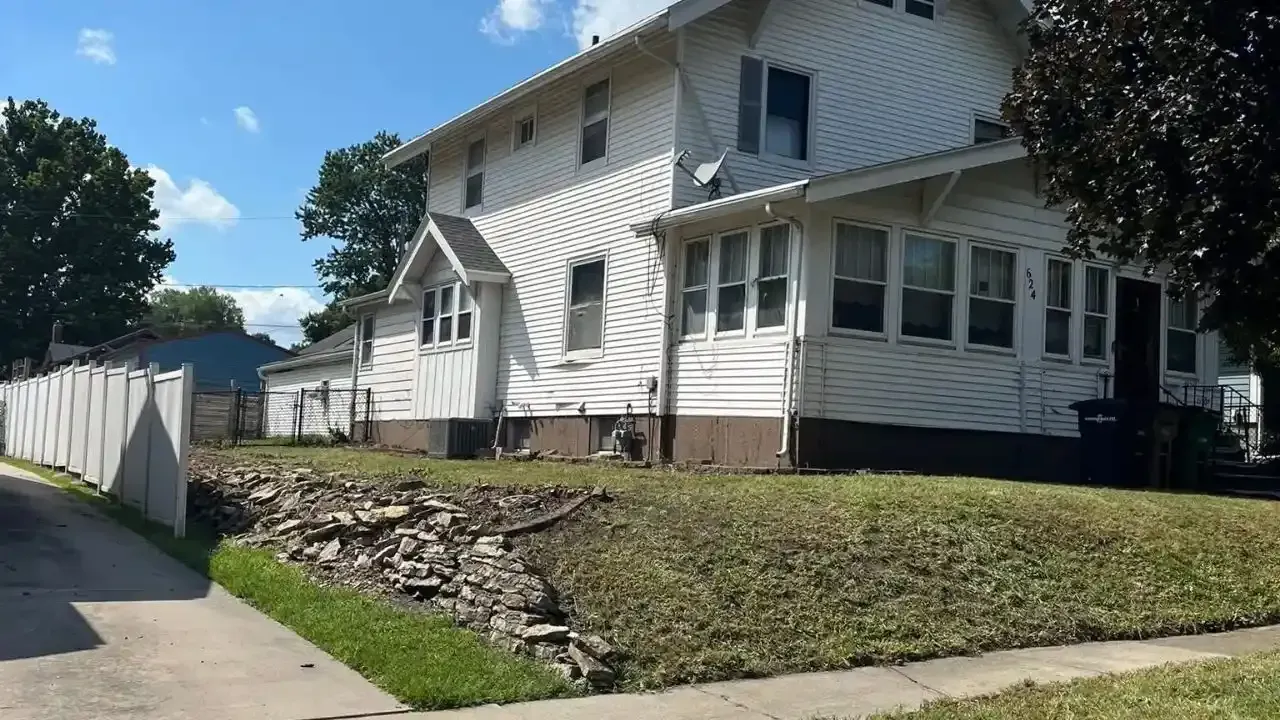 After brush clearing of an overgrown yard in Des Moines, Iowa