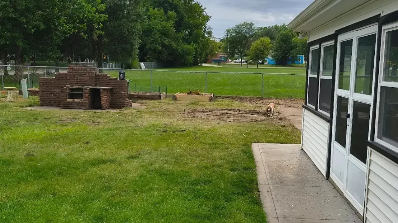 After tree removal in Ames Iowa showing clean yard and removed obstruction