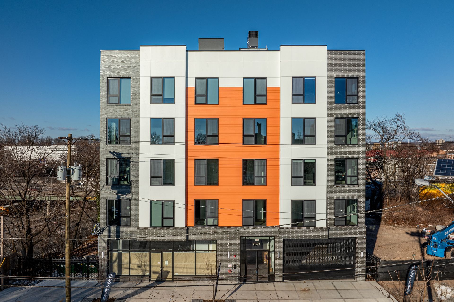 A large orange and white building with a lot of windows- The Unity