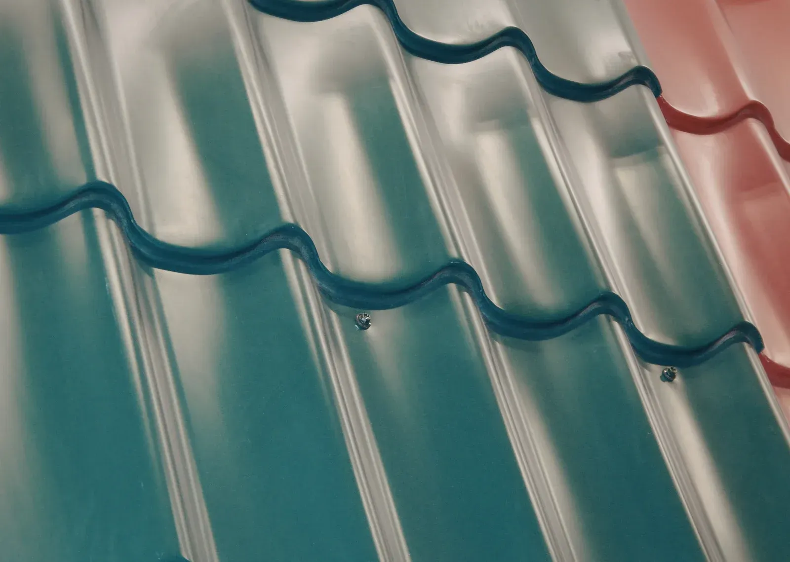 A white bathtub with beige tile walls and floor. A soap dish is mounted on the wall.