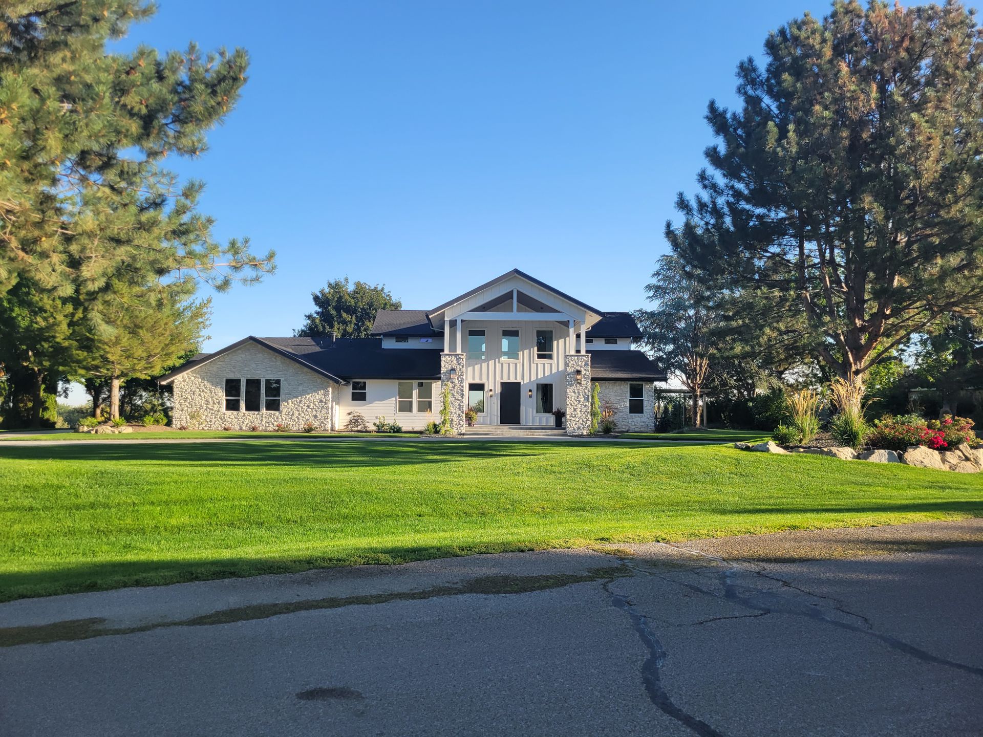 A large house with a lot of grass in front of it