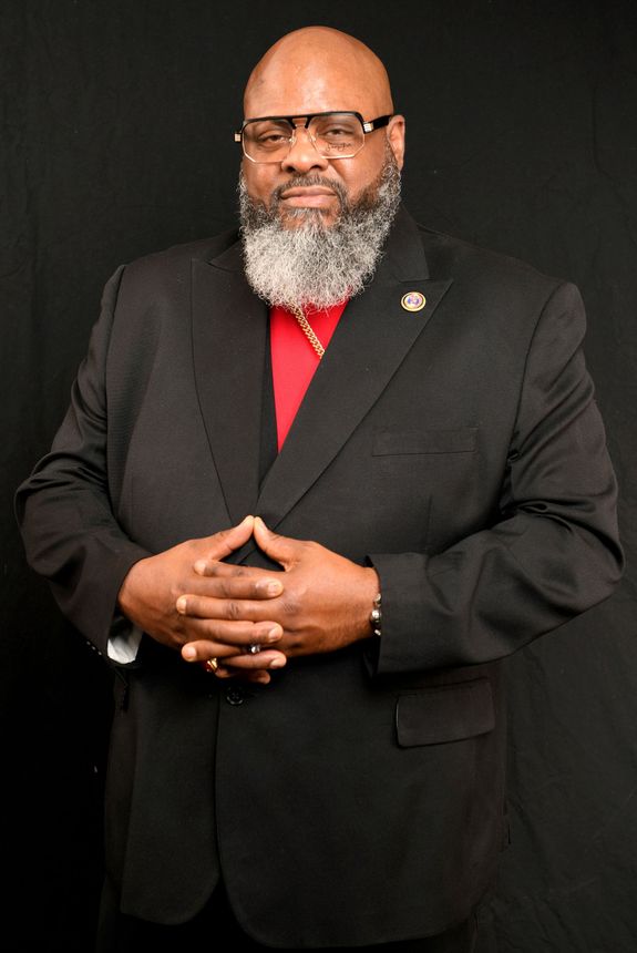 A video game controller with headphones attached to it