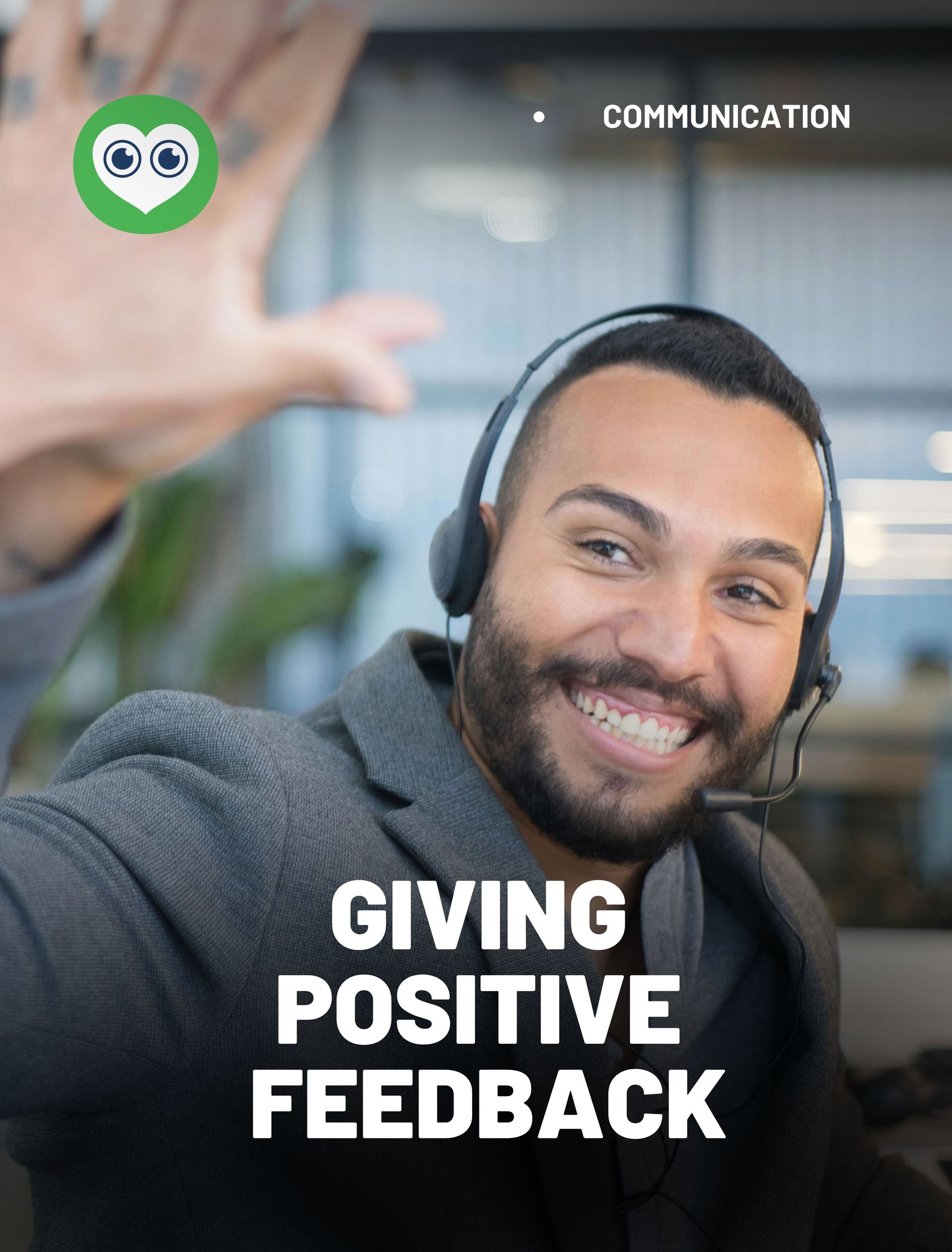 A man wearing headphones is smiling and giving positive feedback.