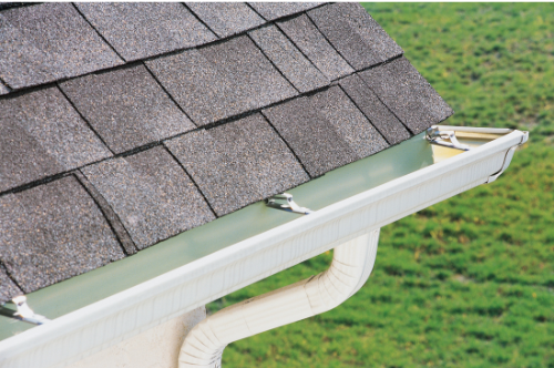 a close up picture of a roof with white gutters in covington, LA