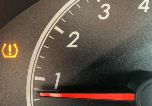 What does the TPMS warning light indicate?
