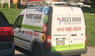 A rick 's repair van is parked in front of a house.