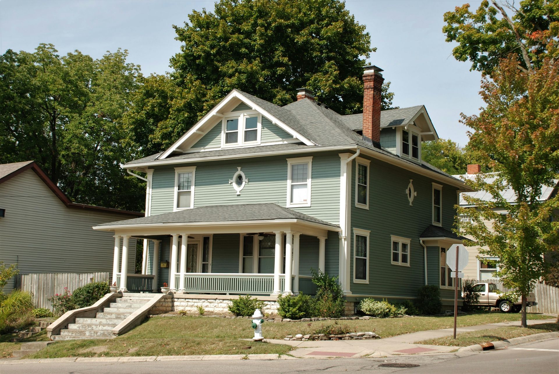 Front view of a Michigan home with sturdy and durable concrete steps.