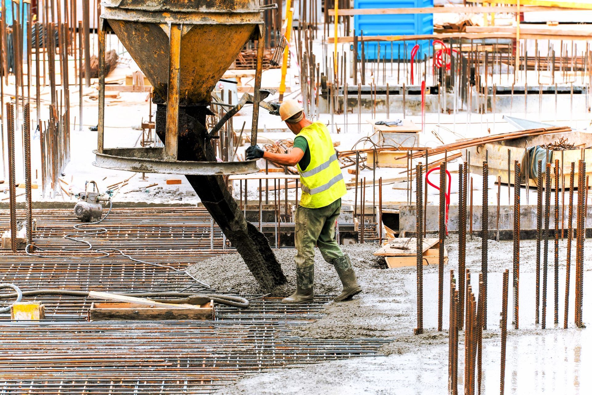 Construction site with workers building a new residential concrete structure