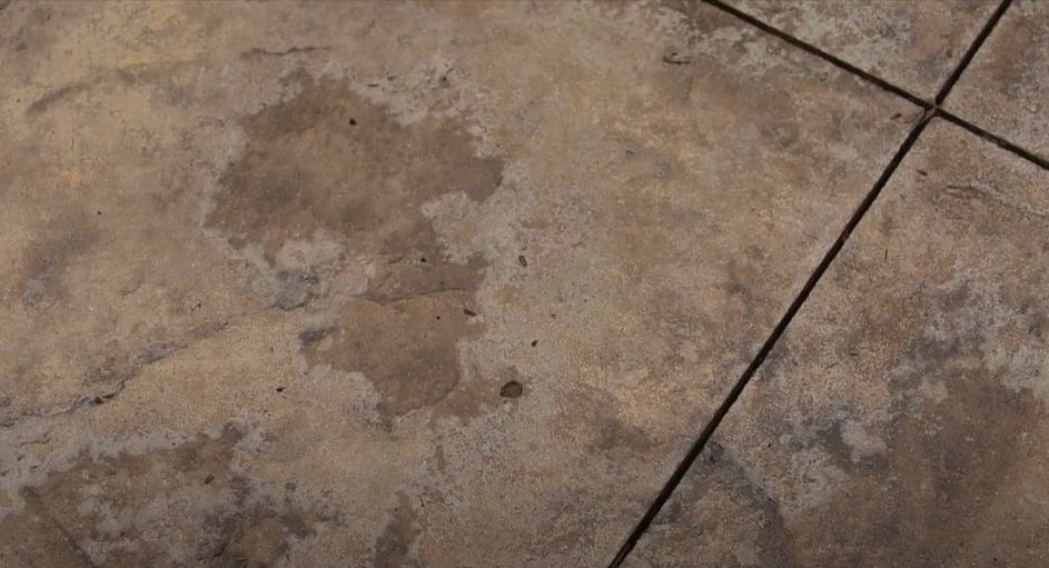 Stamped concrete floor with textured design and weathered finish for decorative flooring