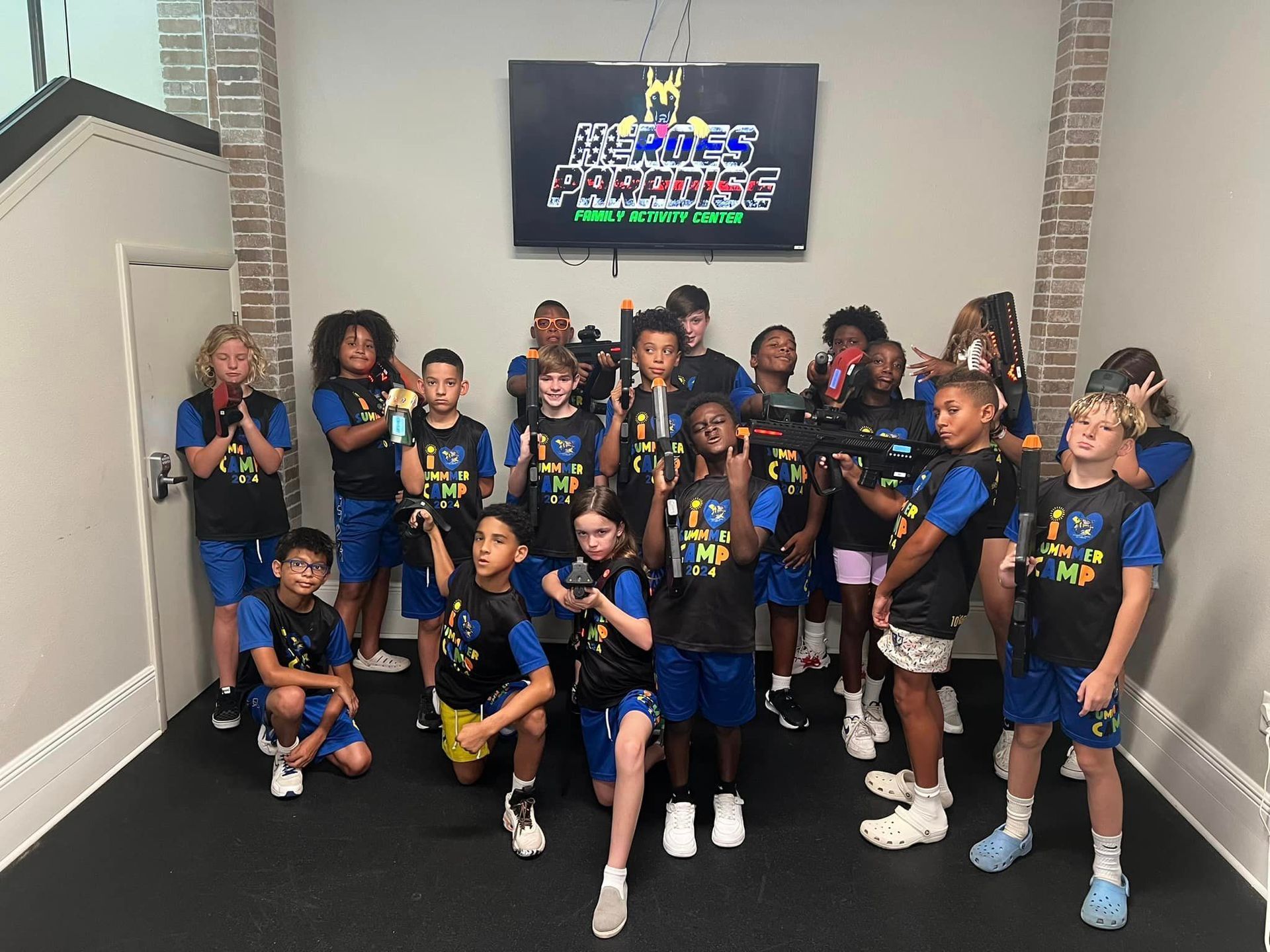A group of children are posing for a picture in a room.
