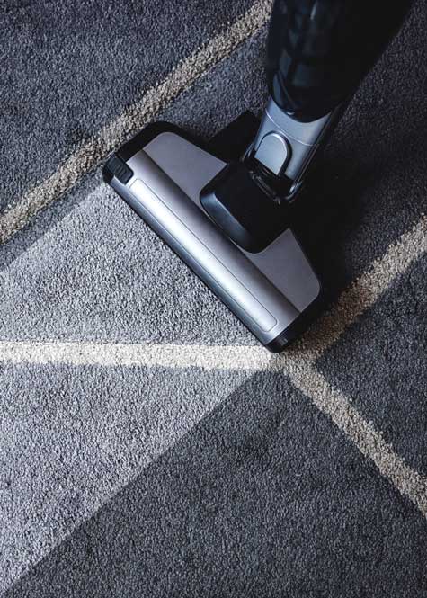 Cleaning a Carpet Using Vacuum Cleaner