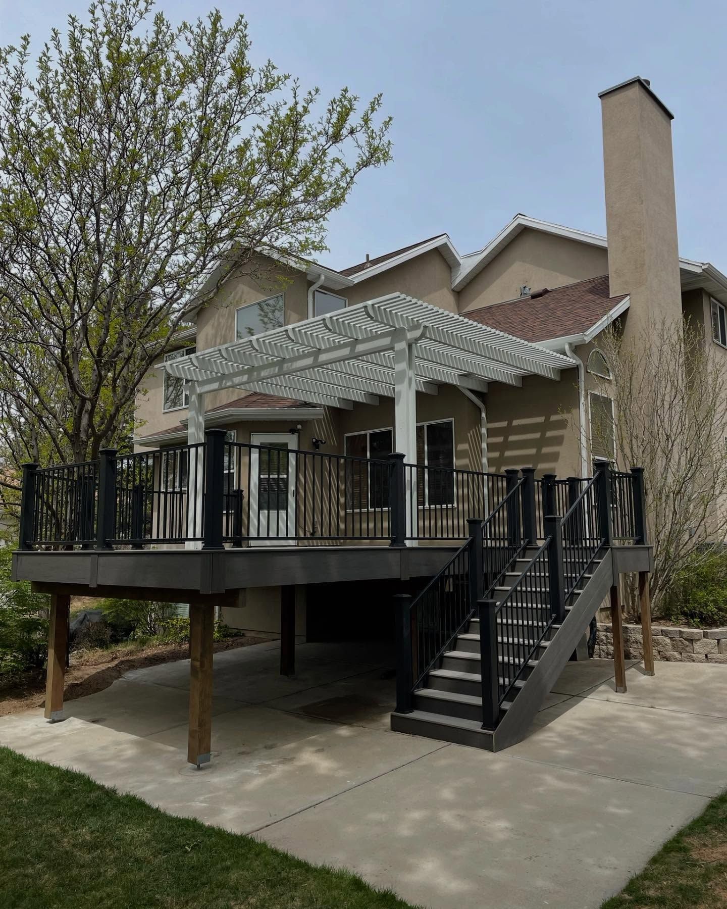 A large house with a large deck and stairs