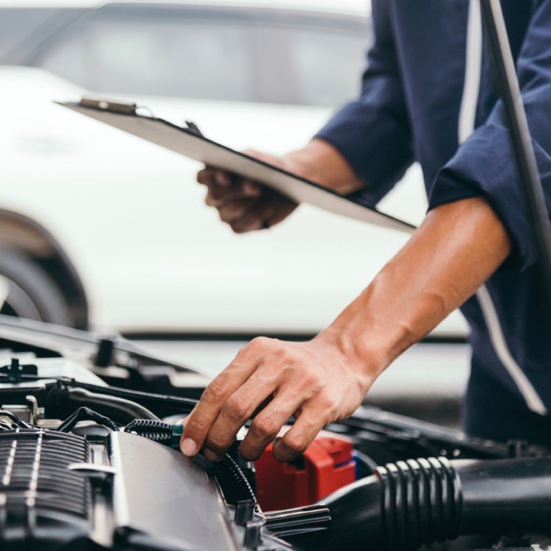 Mechanic doing an auto repair service check