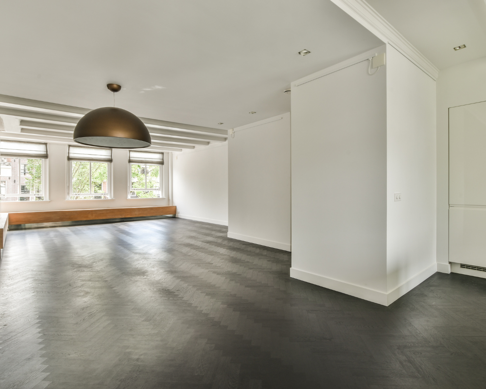 empty modern home with white walls and grey patterned cement flooring