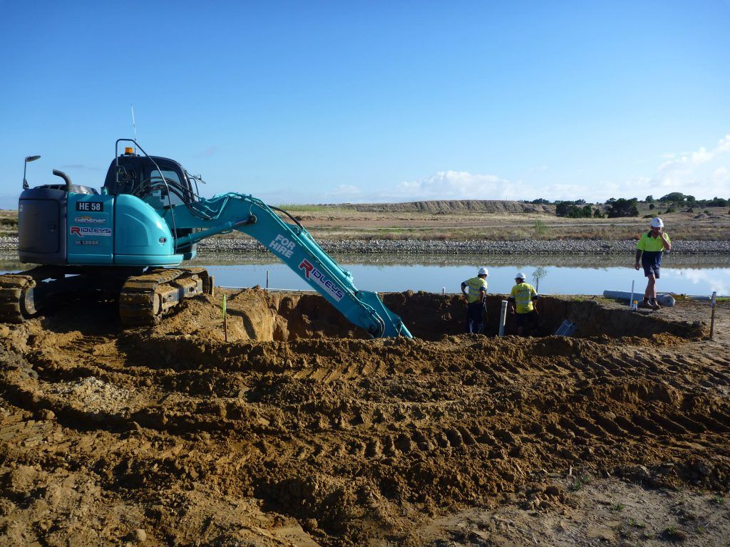A blue excavator with the word r on it | Murray Bridge, SA | Ridleys SA