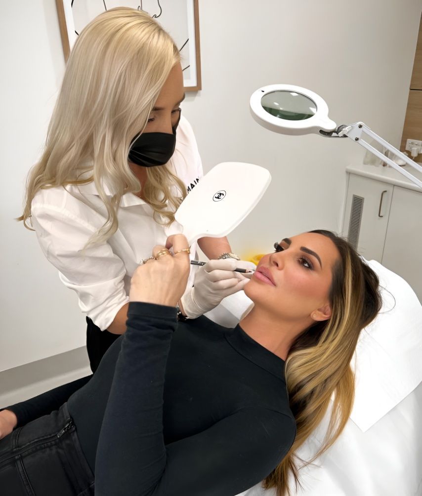 A woman is getting a botox injection in her face while wearing a mask — Sibina Cosmetic Tattoo Art In Broadbeach, QLD