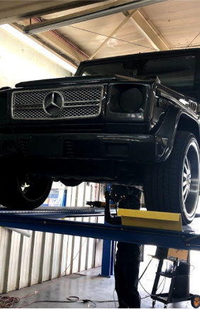 Car In Garage | First Class Auto Service