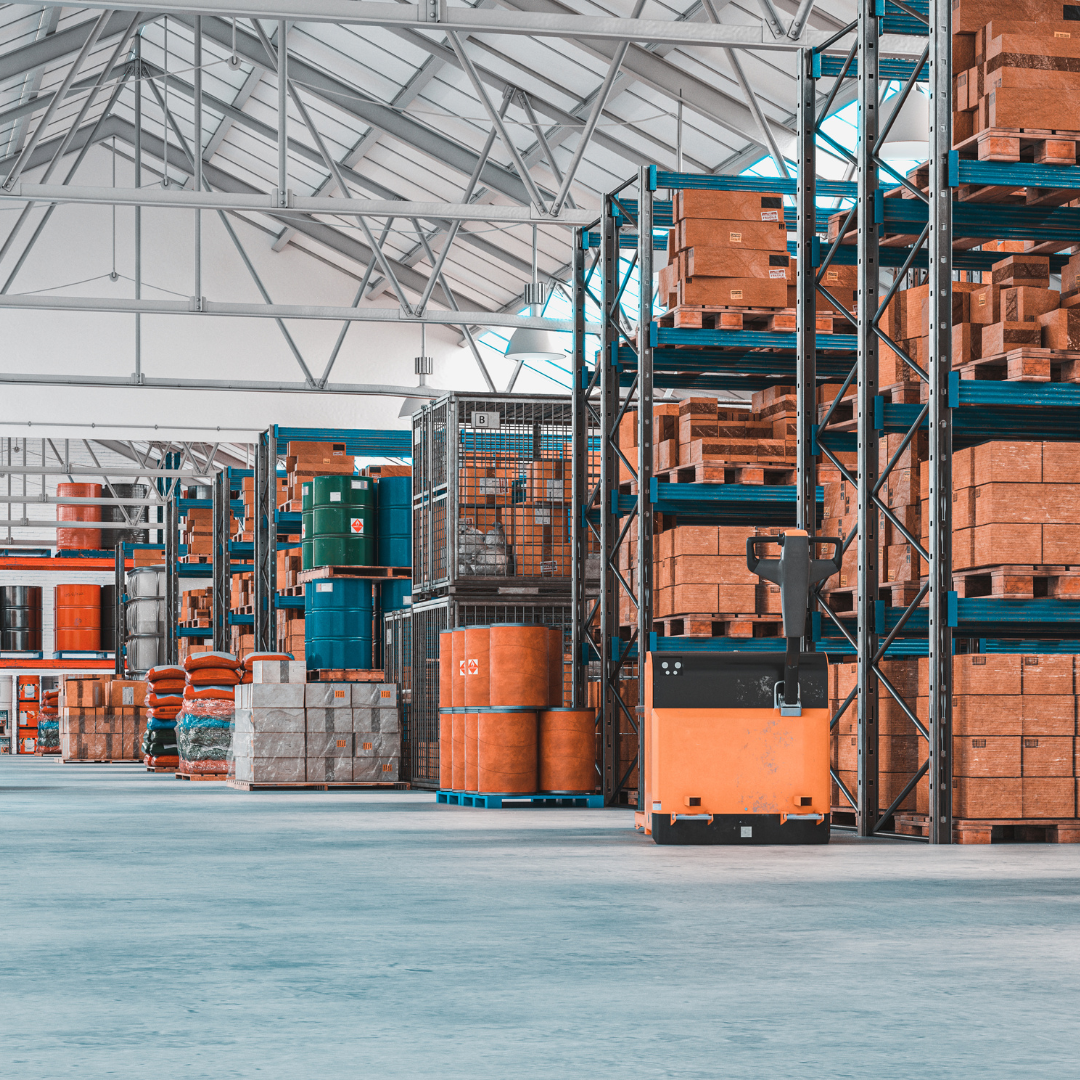 A large warehouse filled with lots of boxes and barrels.