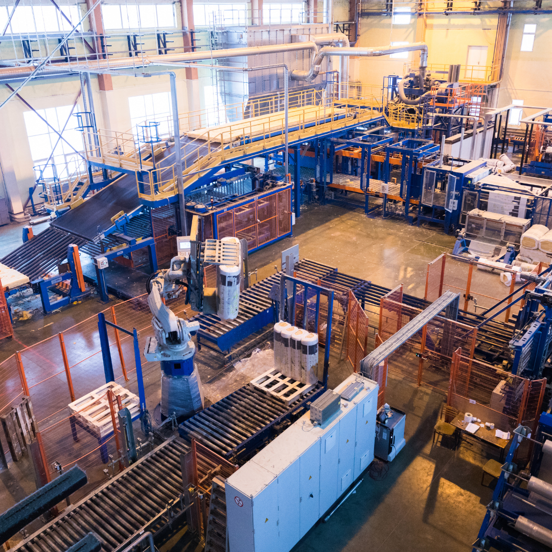 An aerial view of a factory with lots of machinery and conveyor belts.