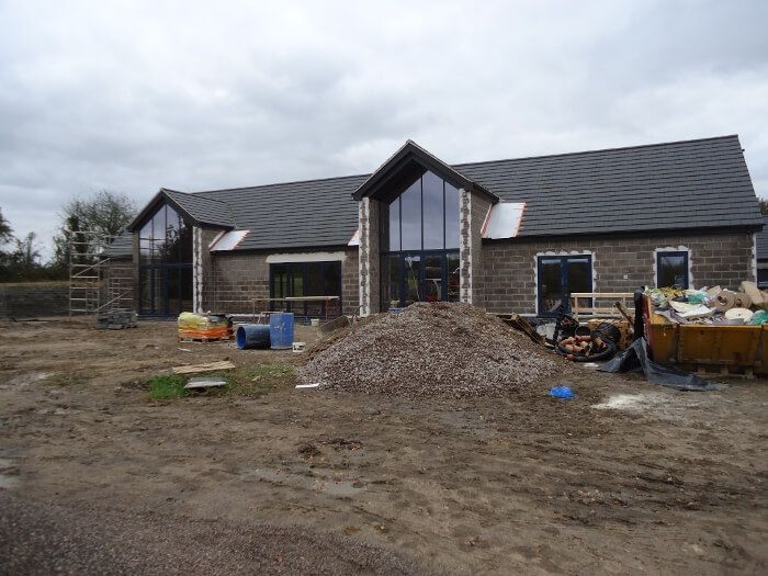 before - long brick house - side view