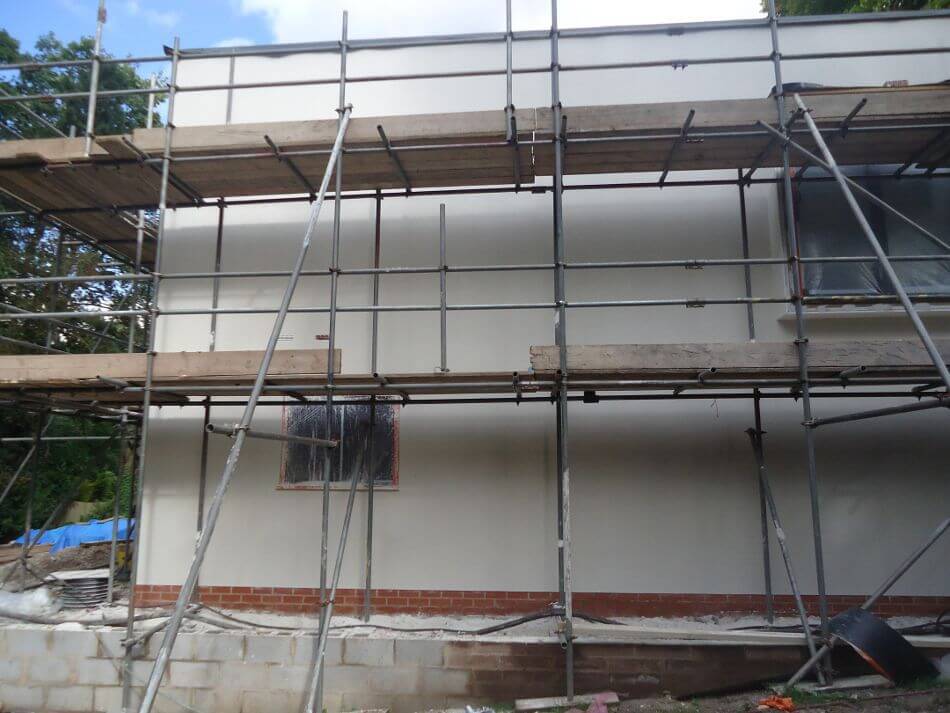 house wall near completion rendering process