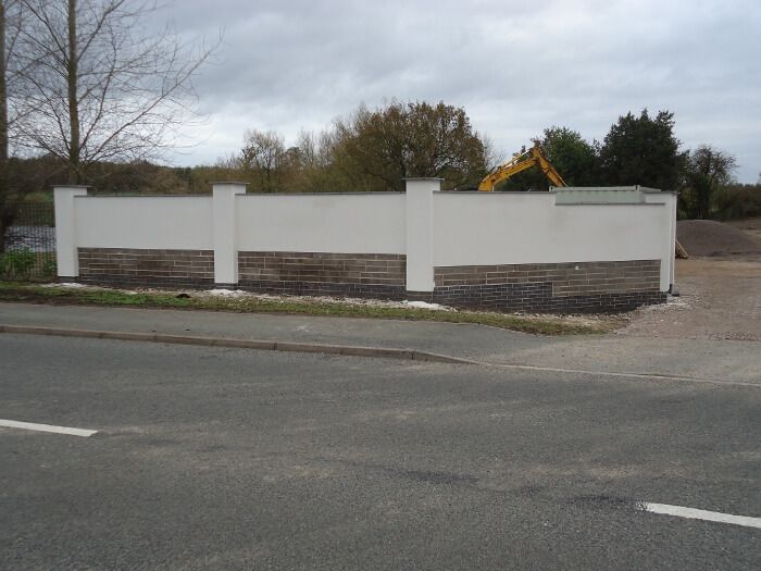 after - rendered brick wall - side view