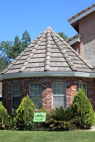 Roofing Maintenance — Small House with Company Logo Far View in Sacramento, CA