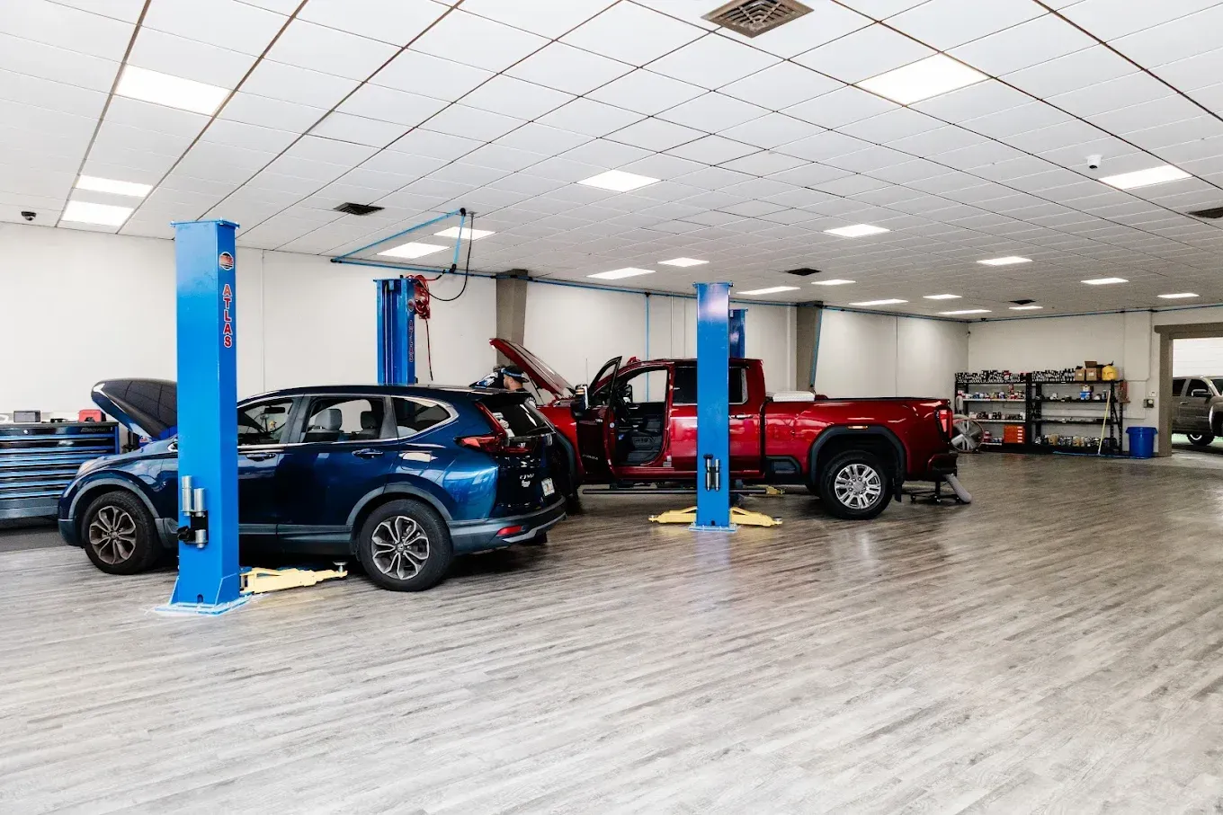 Cars Parked for Repairs in Auto Shop | Pensacola AC & Auto Service Center