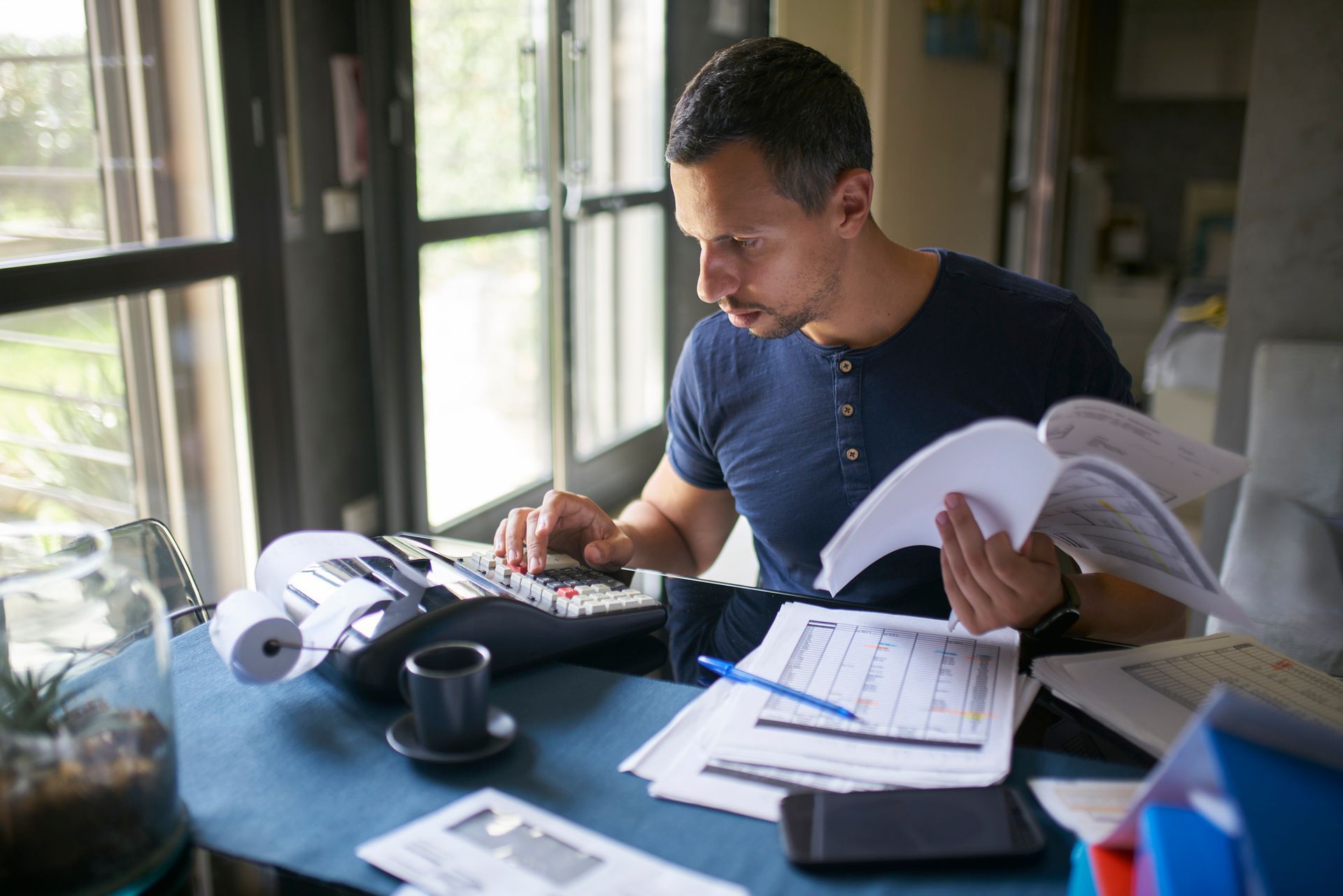 A man is preparing his taxes.