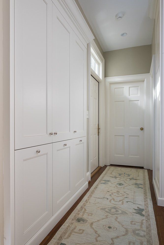 White cabinets in the laundry are