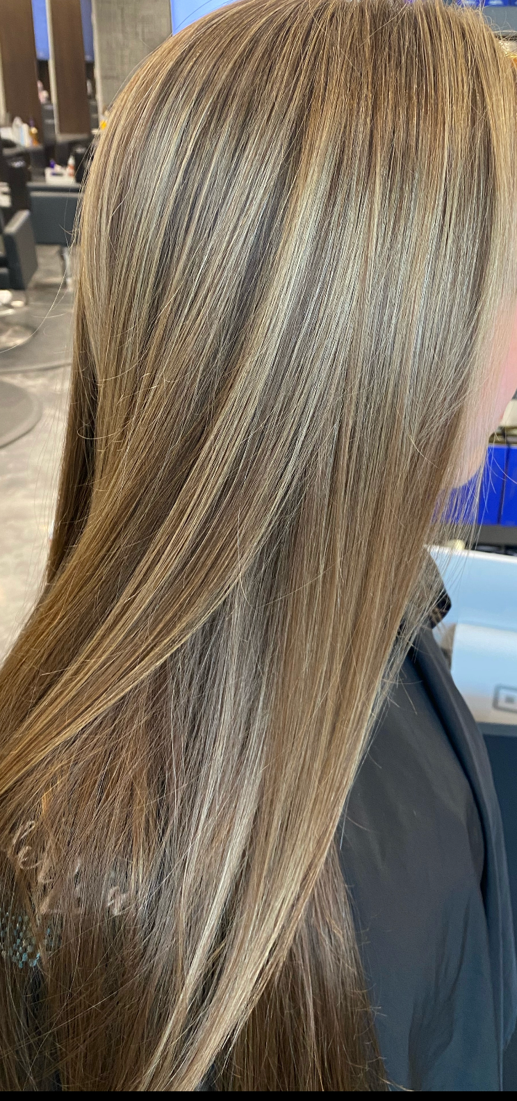 Beauty Team — Hairdresser Straightening Long Brown Hair in Scottsdale, AZ