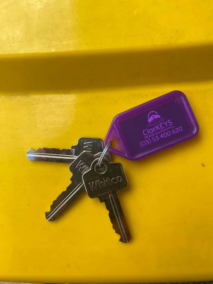 A Bunch Of Keys With A Purple Tag That Says Clarkeys — ClarKEYS Mobile Locksmiths In Winter Valley, VIC