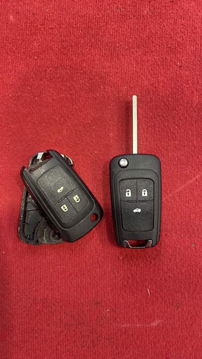 A Pair Of Car Keys Sitting On Top Of A Red Carpet — ClarKEYS Mobile Locksmiths In Winter Valley, VIC