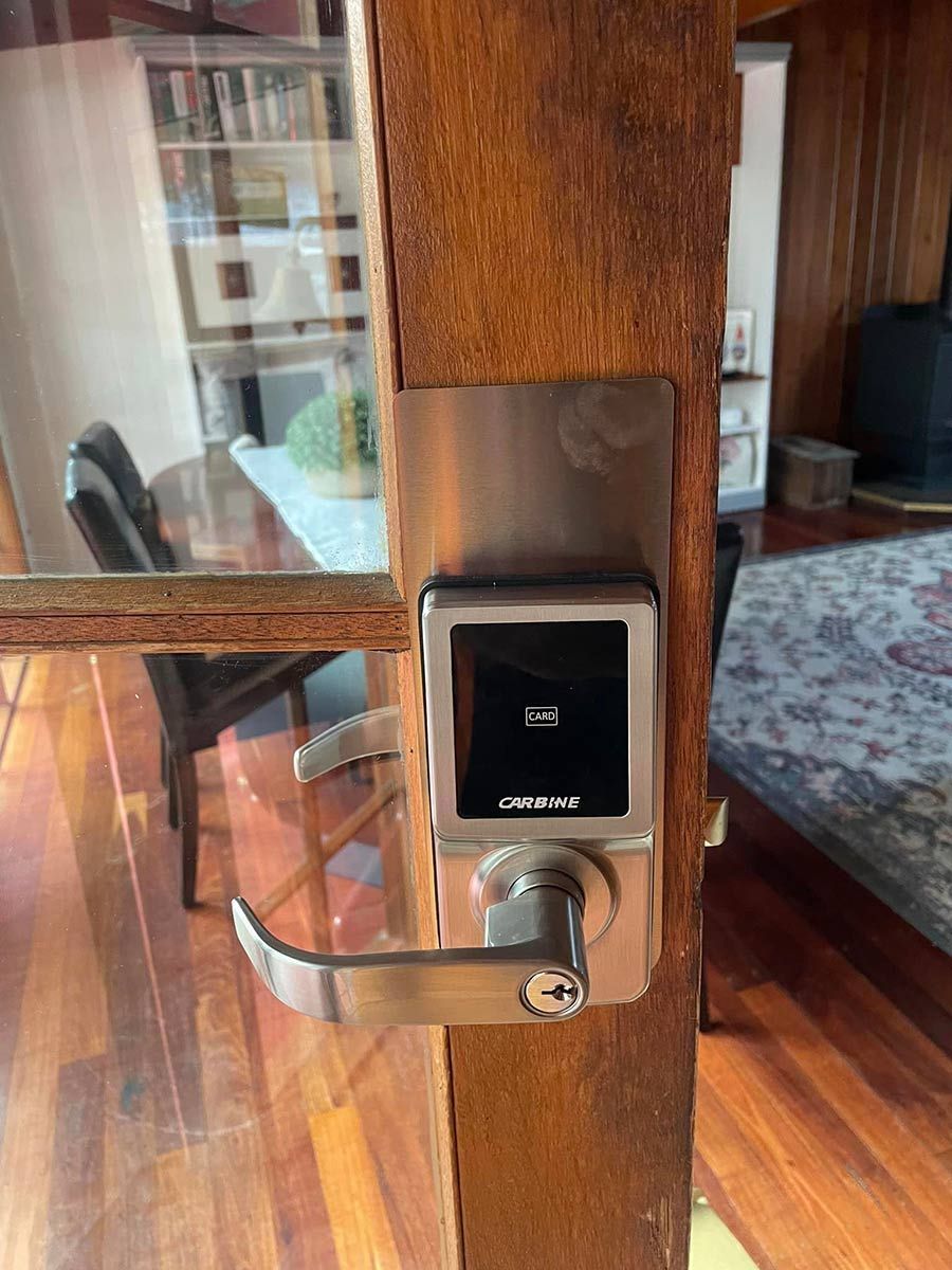A Door With A Smart Lock On It In A Living Room — ClarKEYS Mobile Locksmiths In Winter Valley, VIC