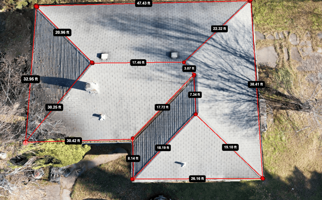 Overhead view of a house roof with red outlines and measurement labels.