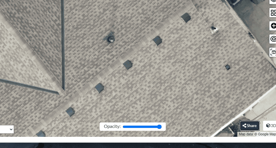 Overhead view of a roof with several square vents and a few other small structures.