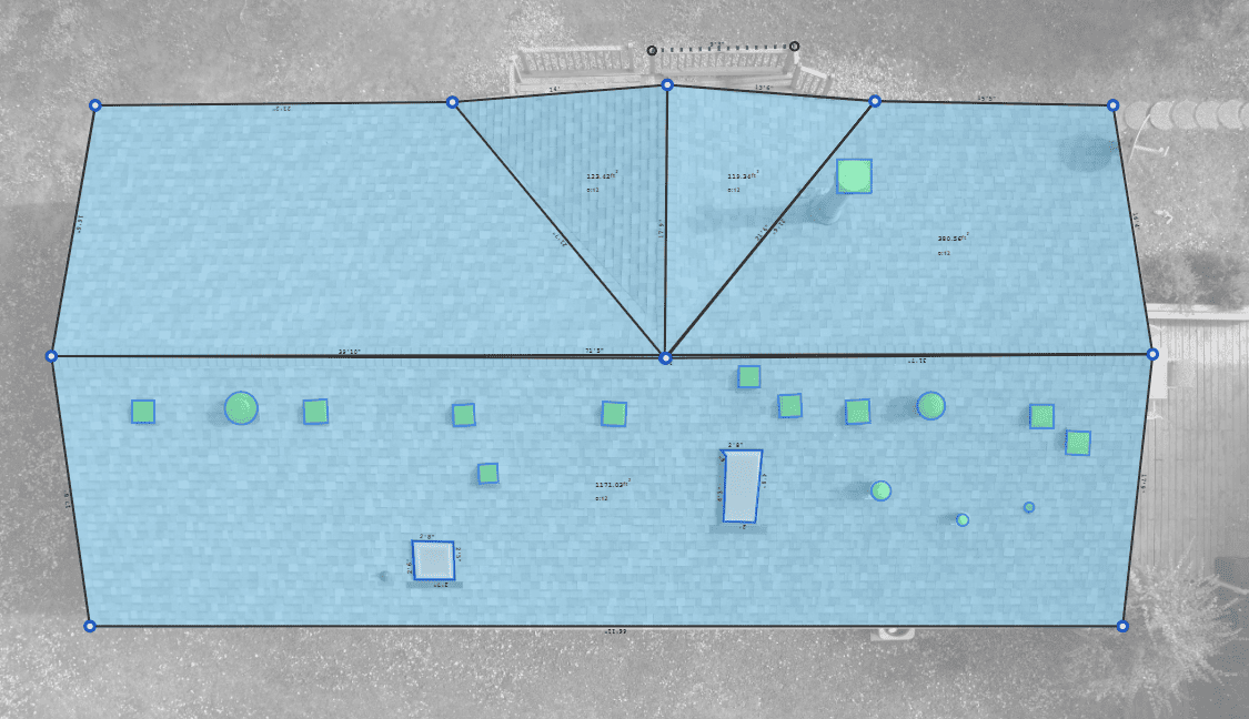Top-down view of a building roof. Light blue roof with several square and rectangular vents, set against a grey background.