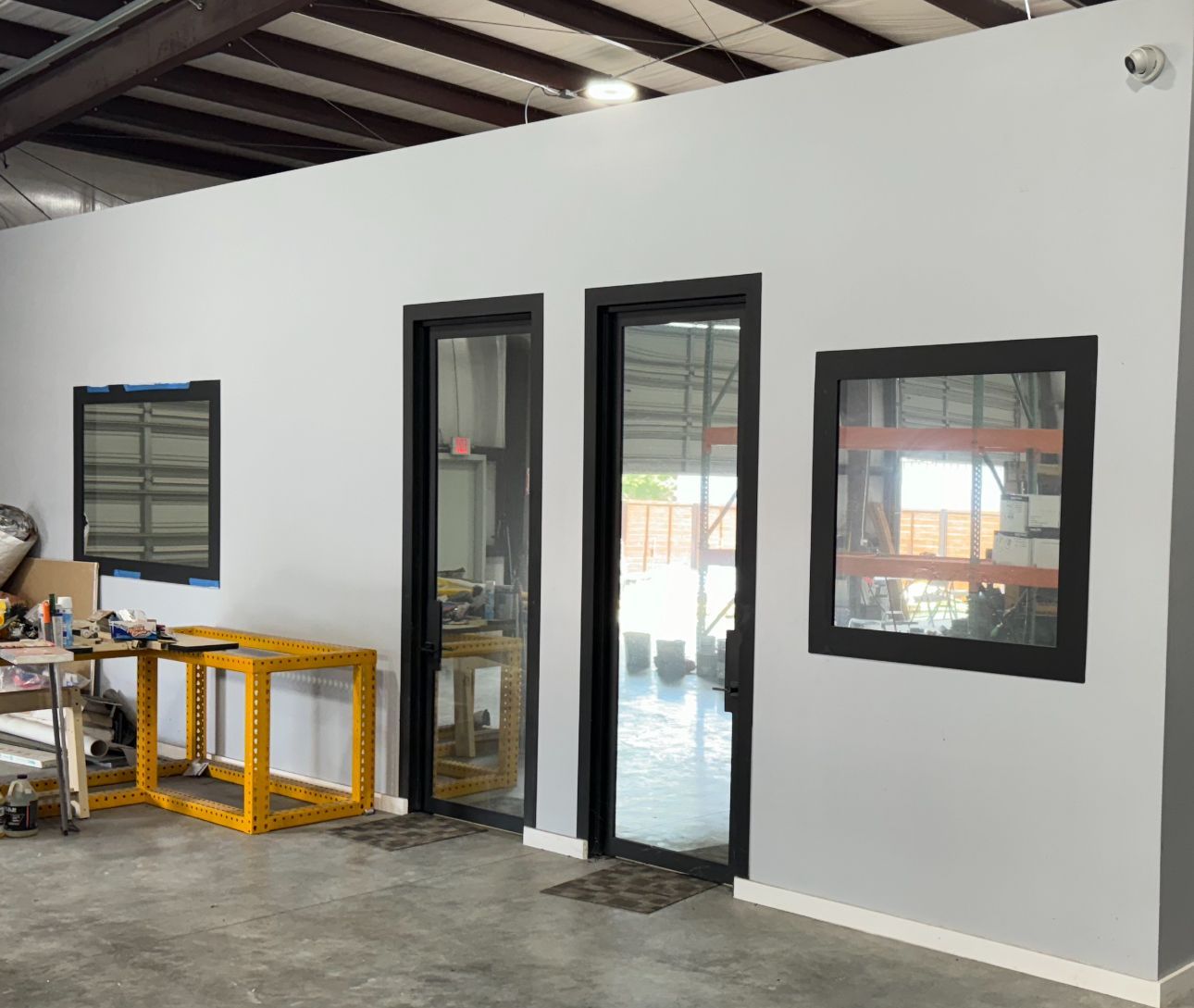 A warehouse with a lot of windows and doors