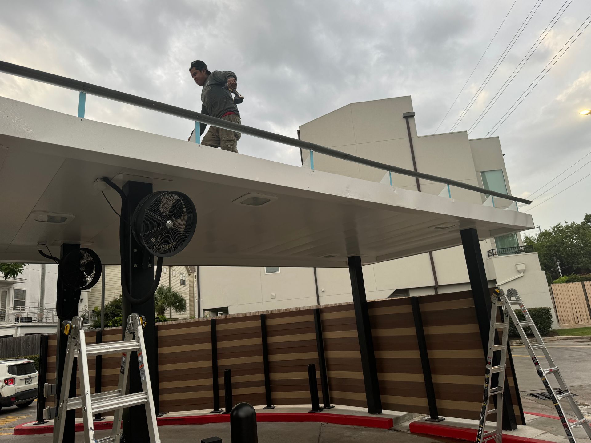 Two workers engaged in cleaning and maintenance duties.